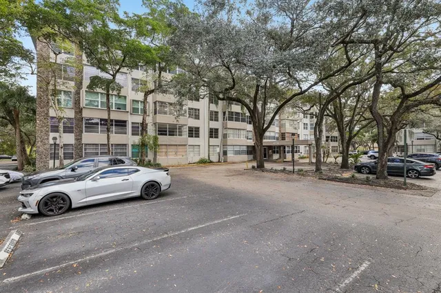a view of street with parked cars