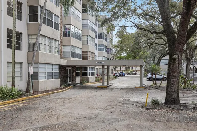 a view of a large building with a street