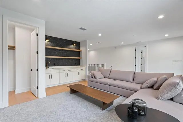 a view of a dining room with furniture and chandelier
