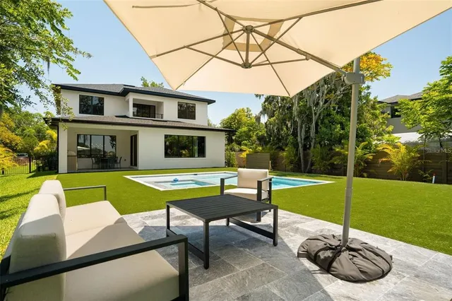 a view of a table and chairs in the garden