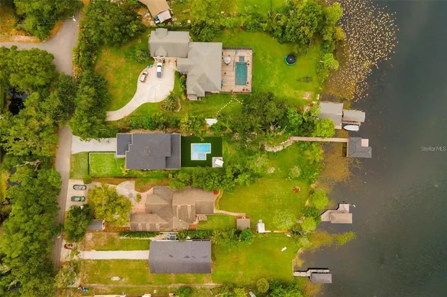 a aerial view of a house with a lake view