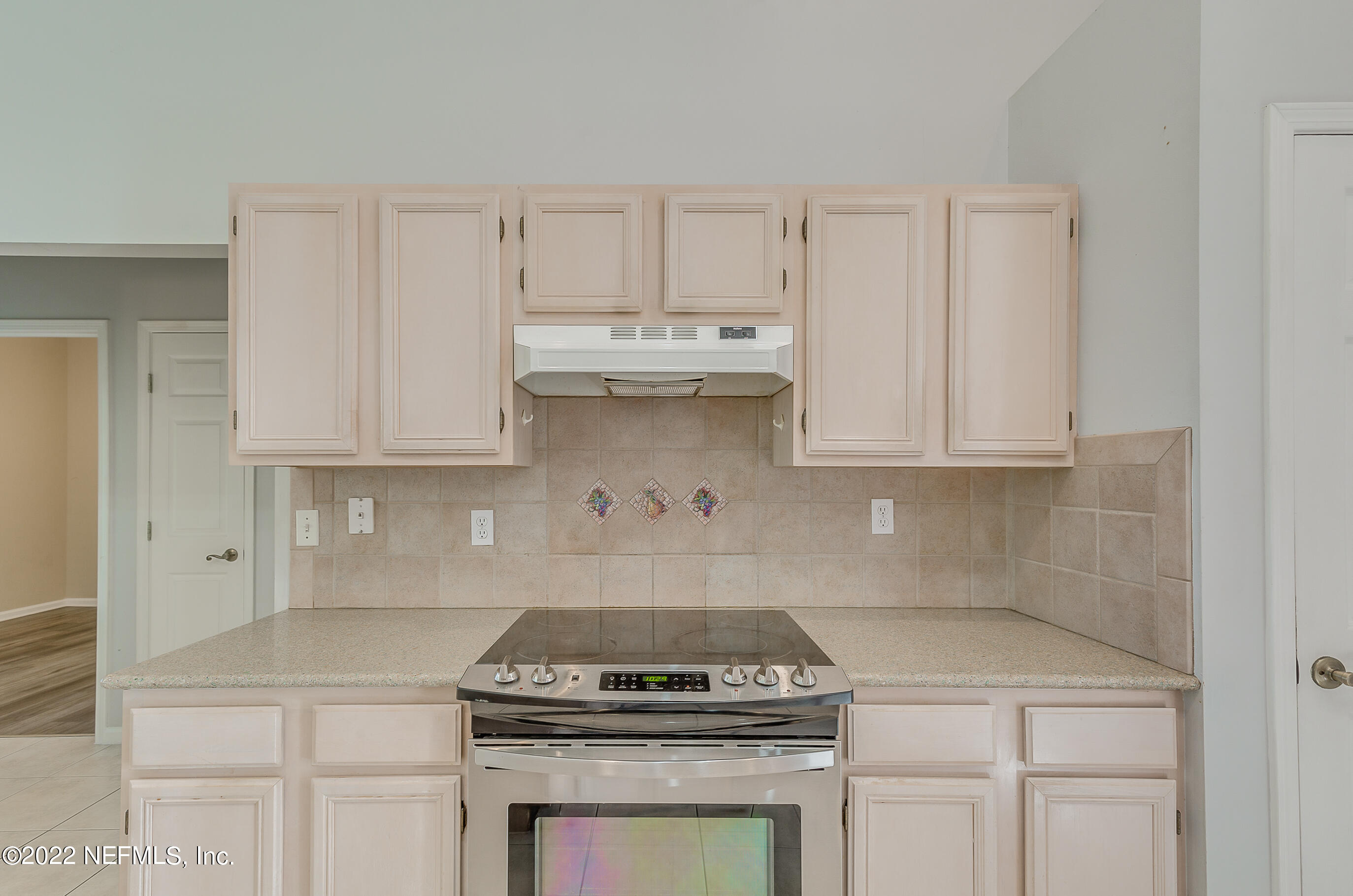 2004 Water Crest Drive Fleming Island, FL 32003 - Photo 17 of 51 a kitchen with granite countertop white cabinets and white stove