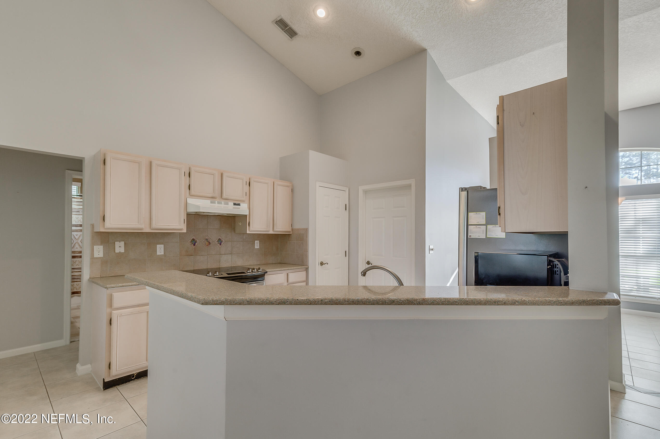 2004 Water Crest Drive Fleming Island, FL 32003 - Photo 21 of 51 a kitchen with stainless steel appliances granite countertop a sink and a stove