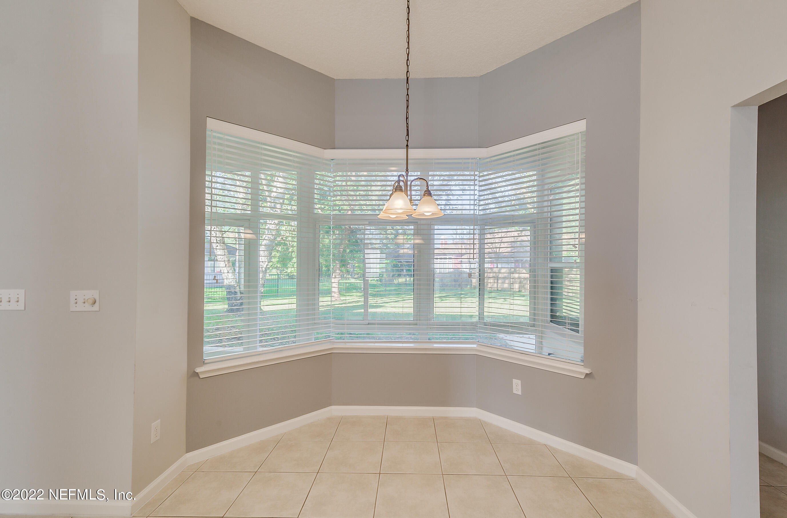 2004 Water Crest Drive Fleming Island, FL 32003 - Photo 23 of 51 a view of an empty room with windows and outdoor view