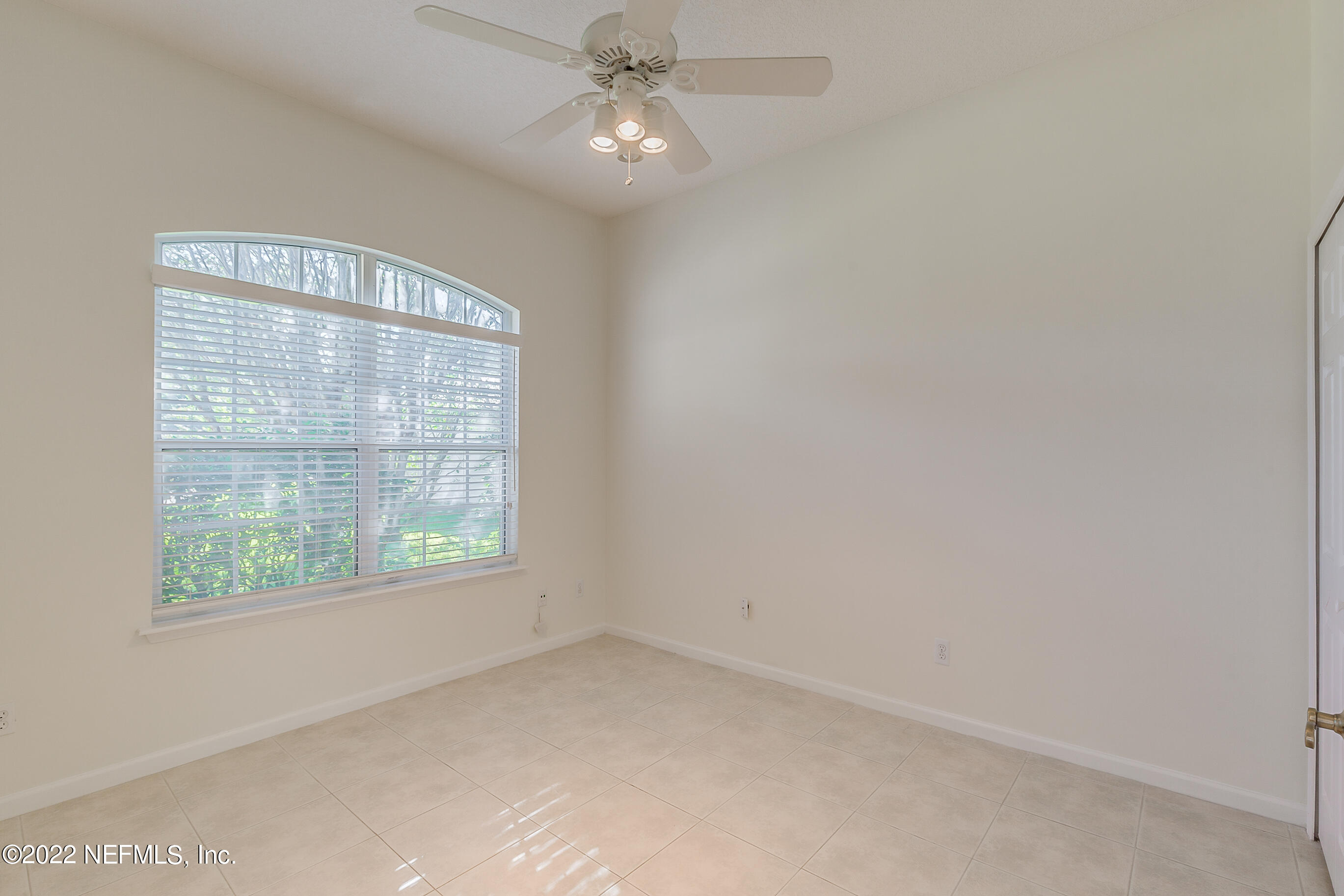 2004 Water Crest Drive Fleming Island, FL 32003 - Photo 25 of 51 an empty room with a window and a fan
