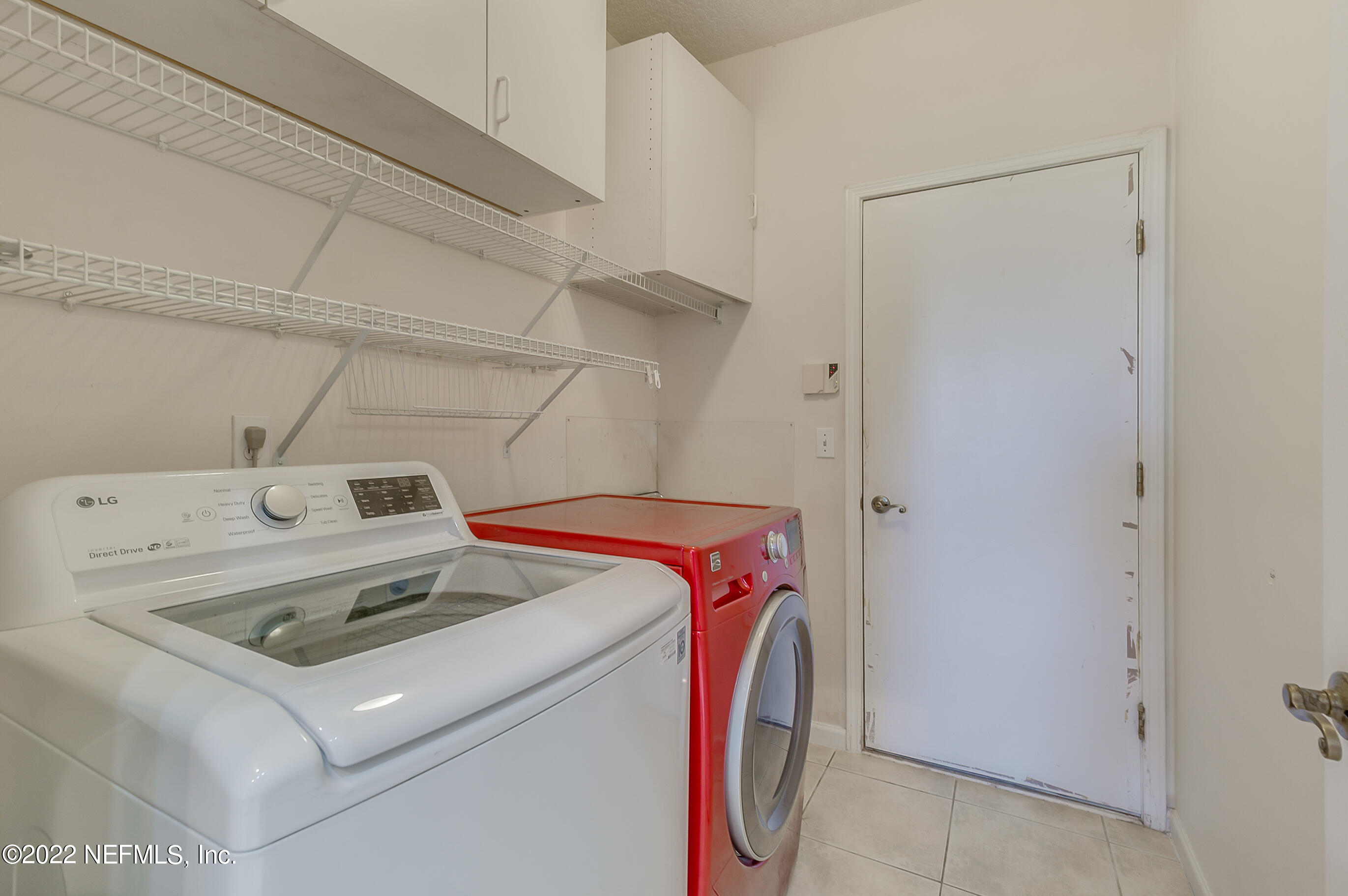 2004 Water Crest Drive Fleming Island, FL 32003 - Photo 36 of 51 a utility room with dryer and washer