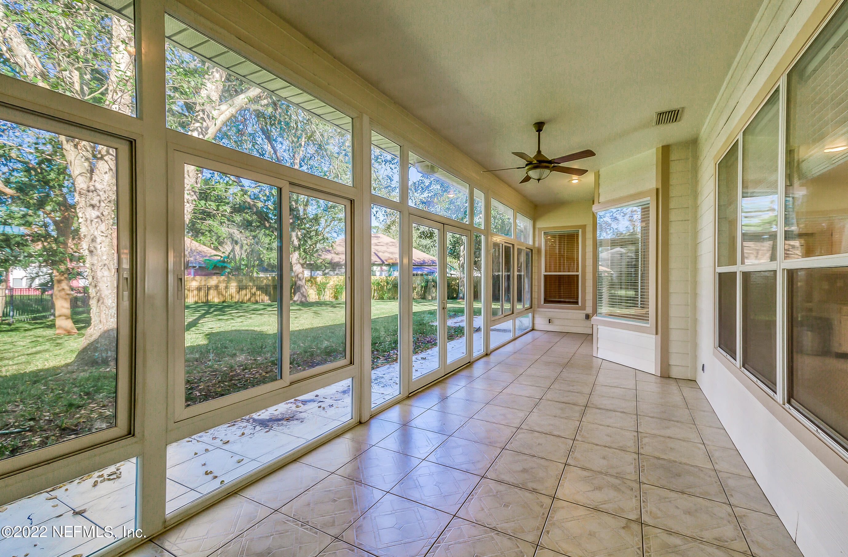 2004 Water Crest Drive Fleming Island, FL 32003 - Photo 39 of 51 a view of a room with windows and door