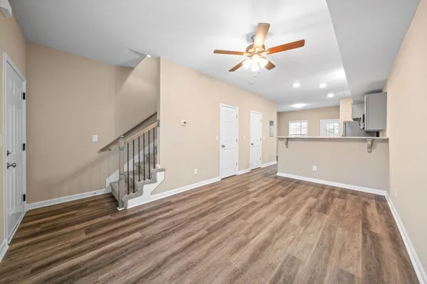 wooden floor in an empty room with a window