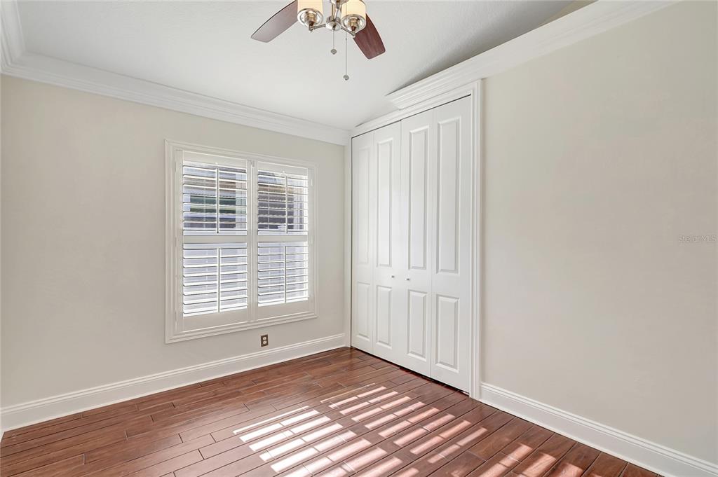 2863 Duncan Tree Circle Valrico, FL 33594 - Photo 34 of 53 a view of an empty room with a window and wooden floor