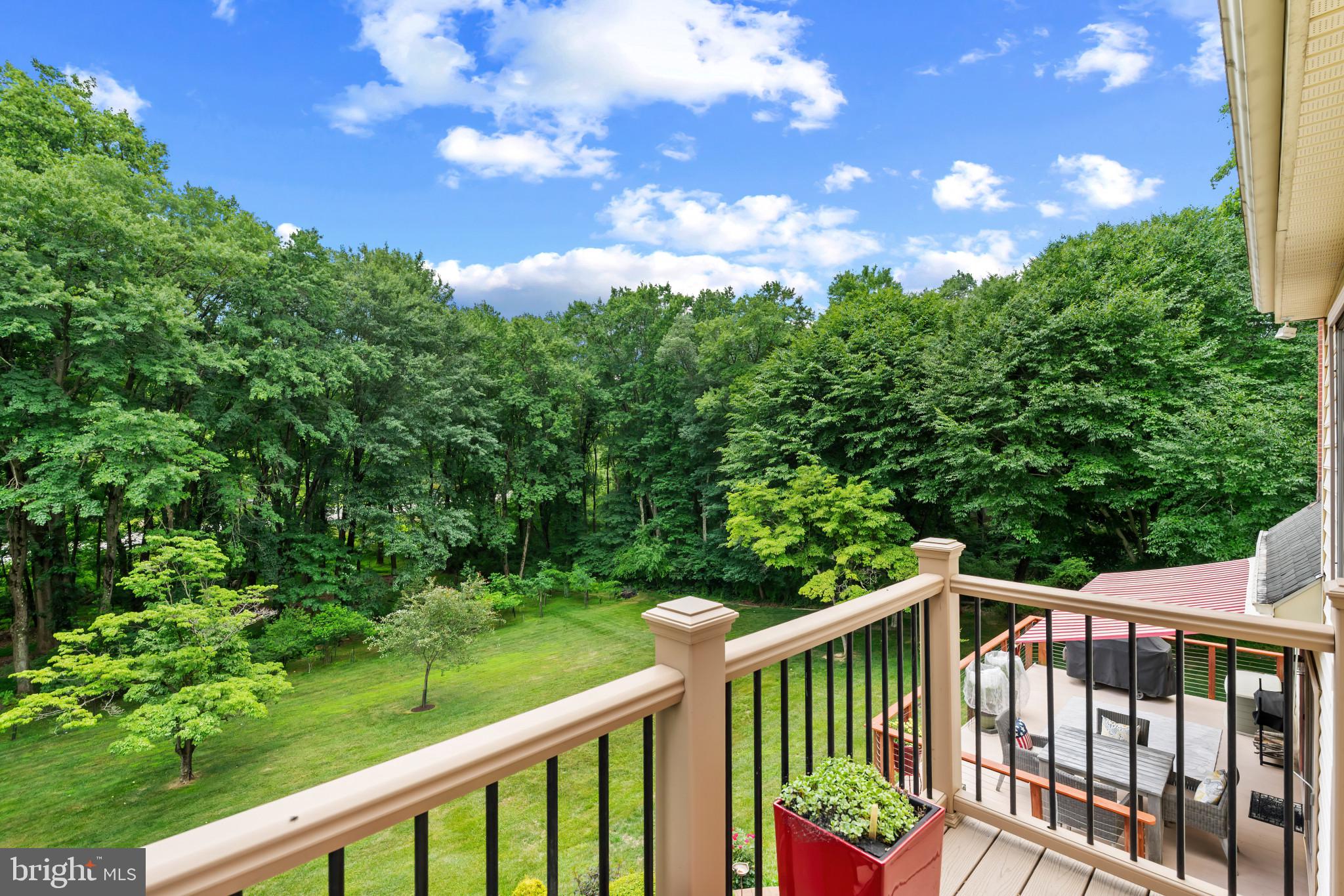 10821 Braeburn Road Columbia, MD 21044 - Photo 55 of 64 a balcony with trees in the back yard