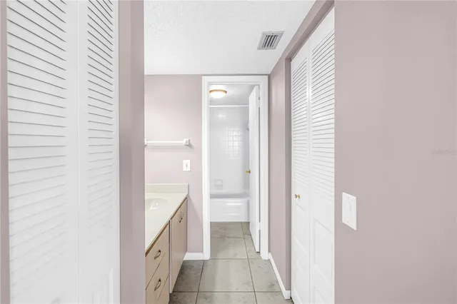 a view of a lake with chairs