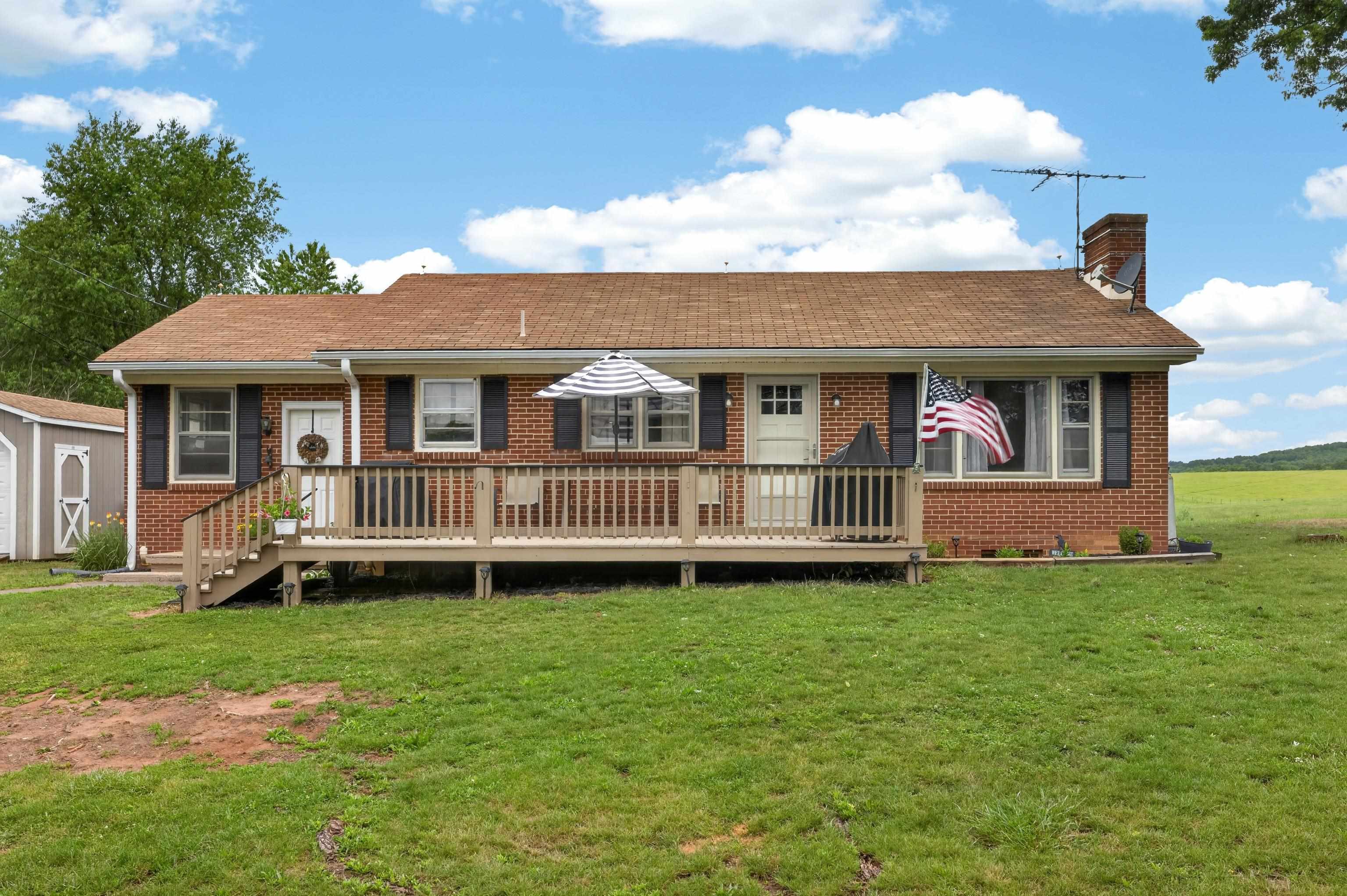 7827 Lee Highway Raphine, VA 24472 - Photo 2 of 62 a view of a house with a yard and deck