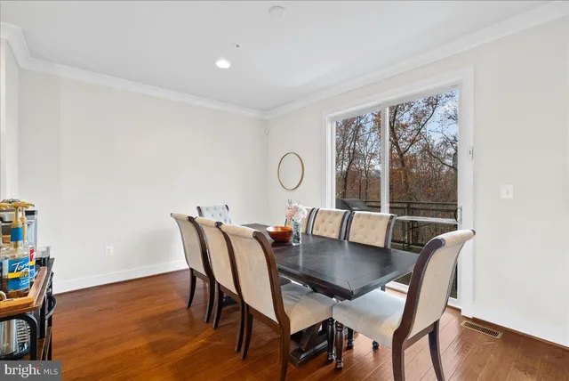 a view of kitchen and dining room with wooden floor
