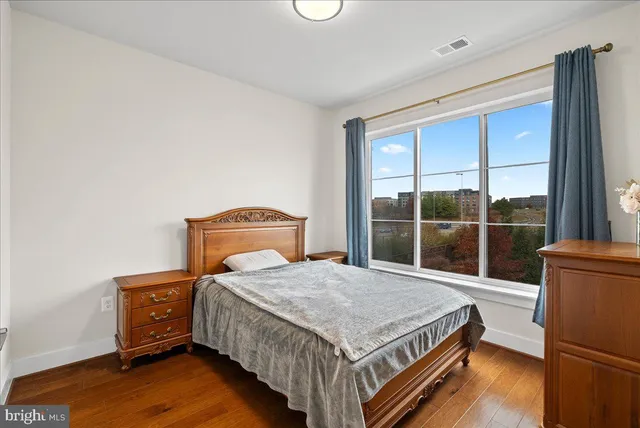 a view of room with wooden floor
