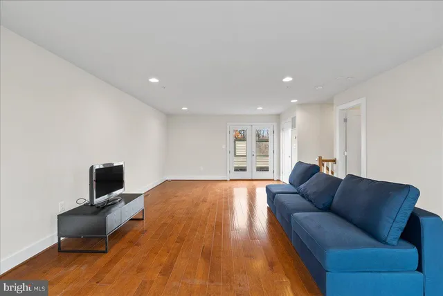 a bathroom with a sink toilet vanity and shower