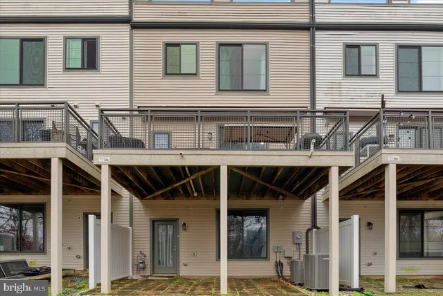 a view of a building with a door and a large window