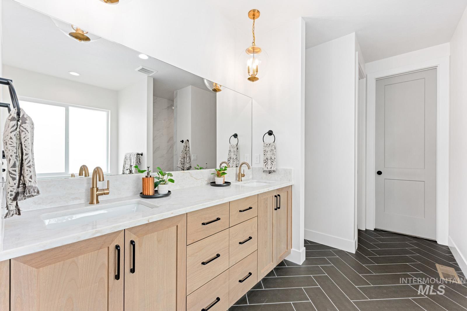 6792 Saddle Bred Way Star, ID 83669 - Photo 21 of 50 Bathroom with double vanity and baseboards