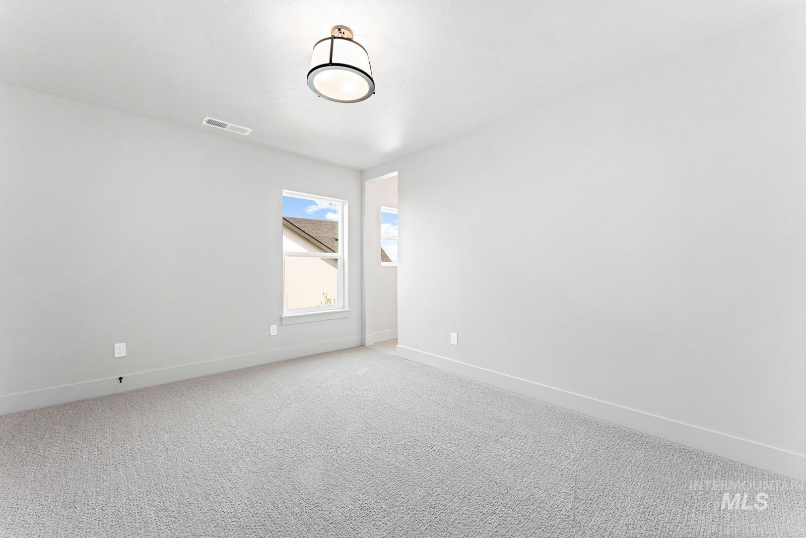 6792 Saddle Bred Way Star, ID 83669 - Photo 29 of 50 Spare room with baseboards and light colored carpet