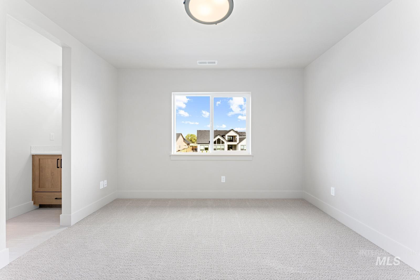 6792 Saddle Bred Way Star, ID 83669 - Photo 33 of 50 Unfurnished room with light colored carpet and baseboards