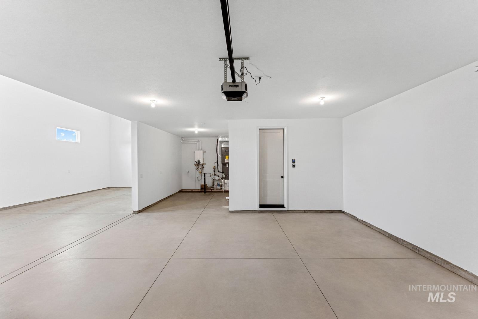 6792 Saddle Bred Way Star, ID 83669 - Photo 35 of 50 Garage with water heater