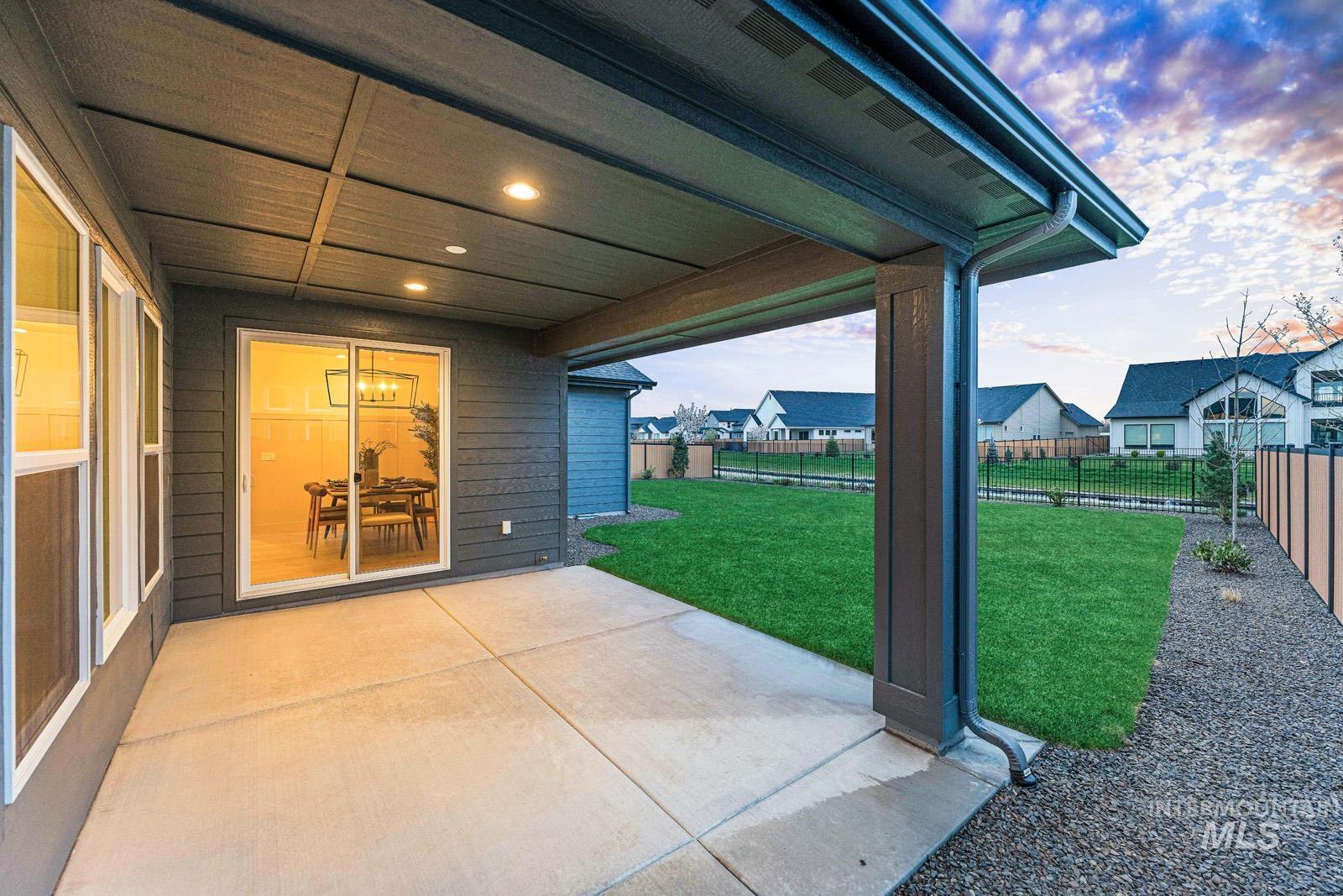 6792 Saddle Bred Way Star, ID 83669 - Photo 37 of 50 Fenced backyard with a patio area and a residential view