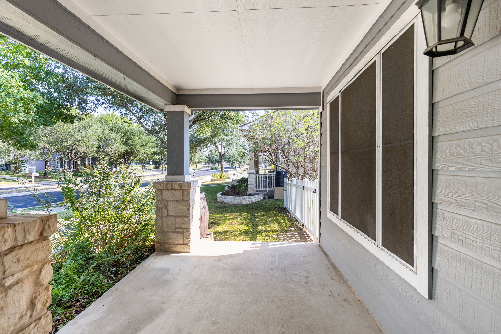 784 Sampson Kyle, TX 78640 - Photo 7 of 40 Stone pillars support the covered porch overlooking the neighborhood.
