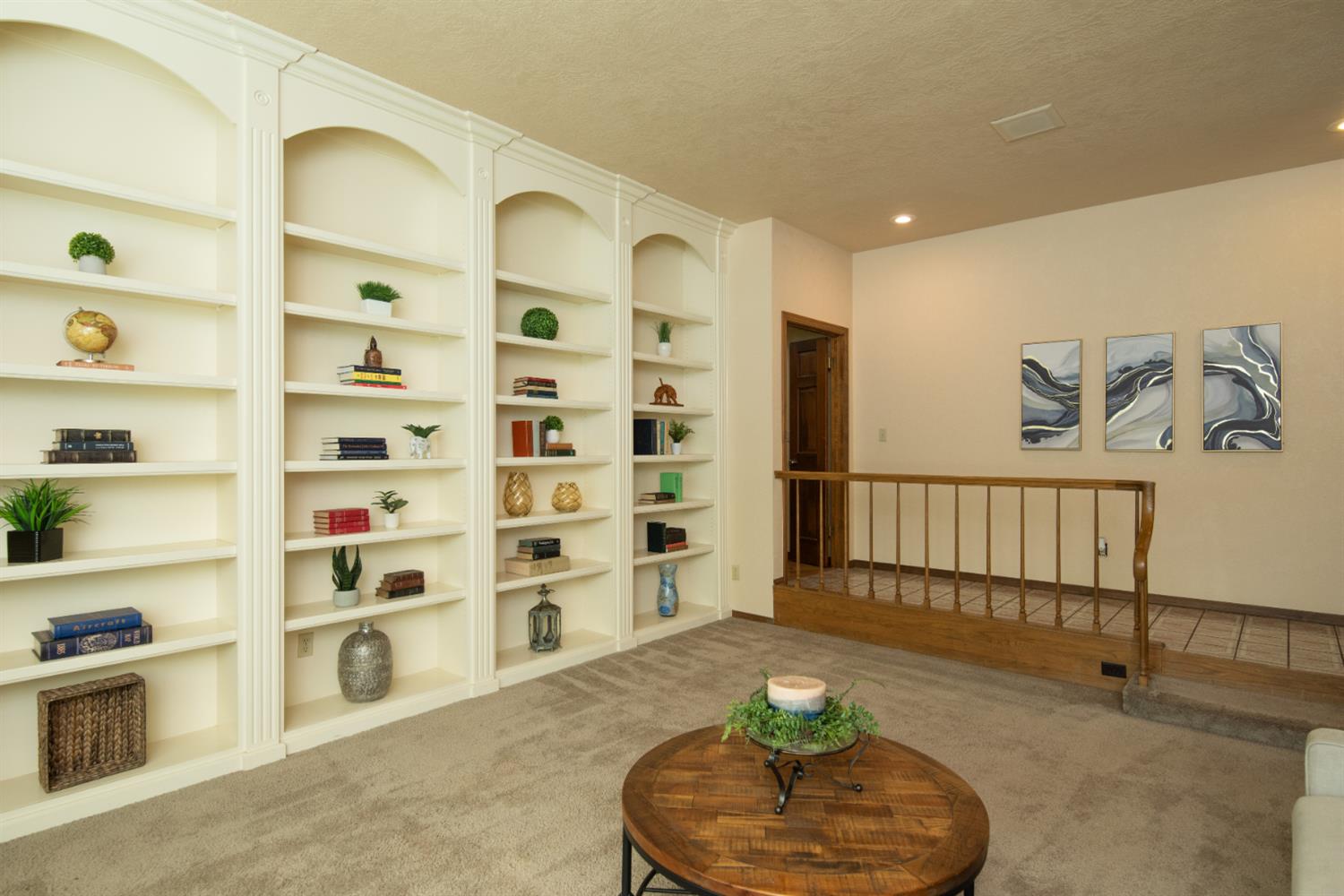 925 Scenic Court Modesto, CA 95355 - Photo 11 of 62 a living room with furniture and a book shelf