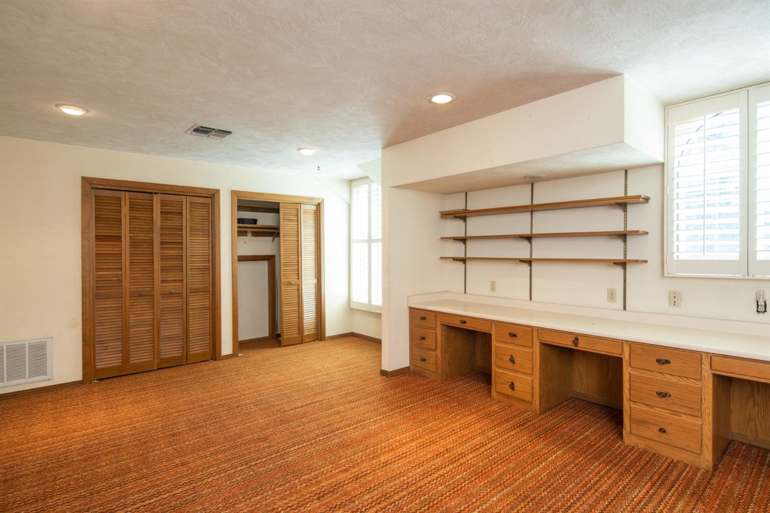 925 Scenic Court Modesto, CA 95355 - Photo 30 of 62 an empty room with wooden floor and cabinet