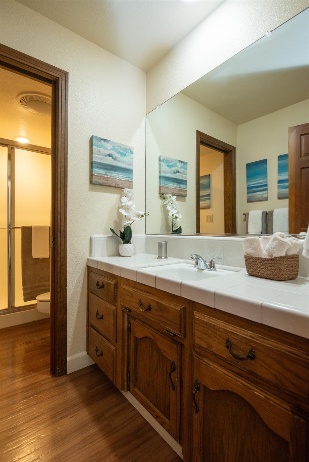 925 Scenic Court Modesto, CA 95355 - Photo 36 of 62 a bathroom with a granite countertop sink mirror and window