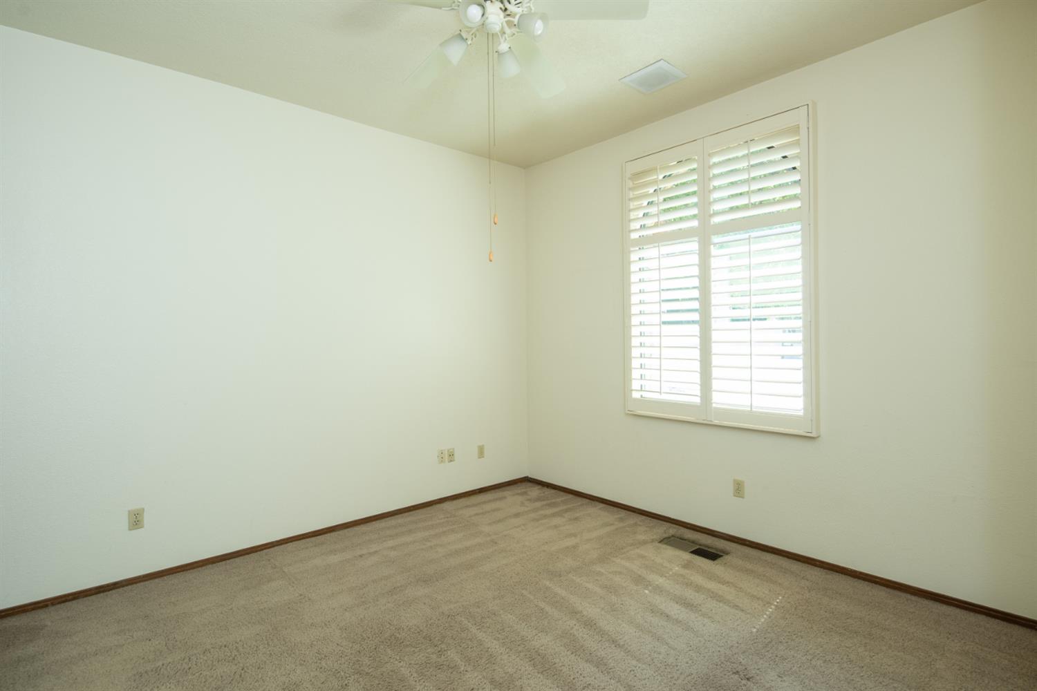 925 Scenic Court Modesto, CA 95355 - Photo 48 of 62 an empty room with a window