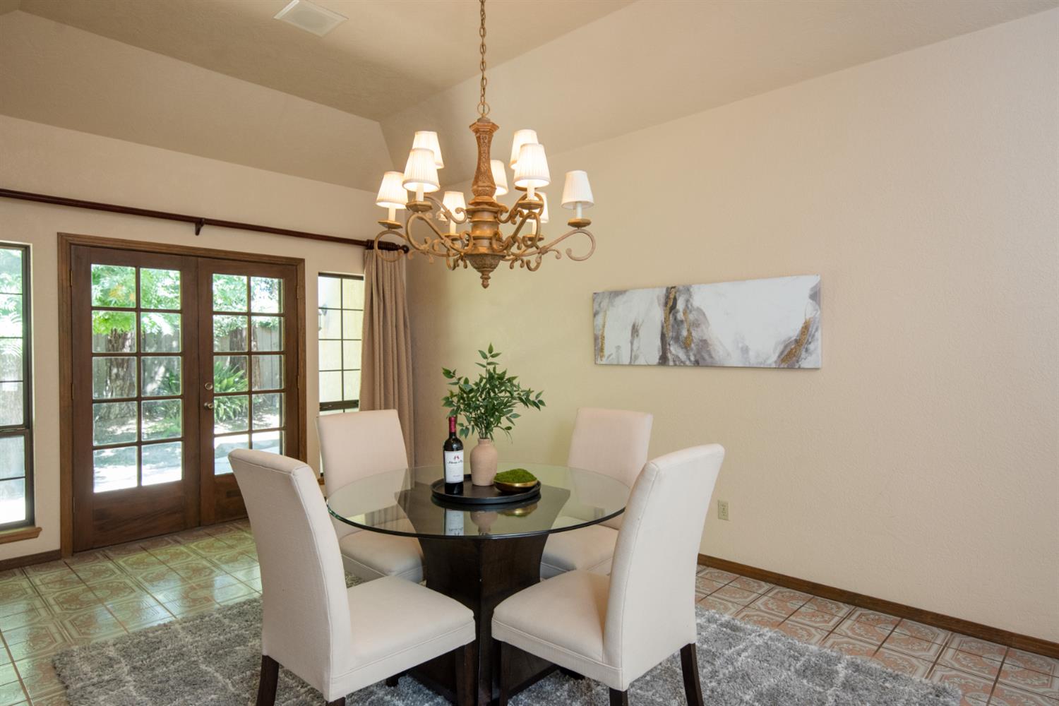 925 Scenic Court Modesto, CA 95355 - Photo 6 of 62 a dining room with furniture a chandelier and window