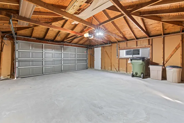 a view of empty room with wooden ceiling