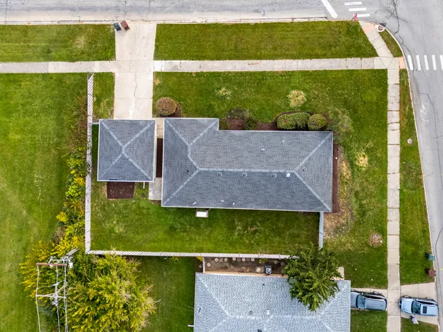 an aerial view of a house with a garden