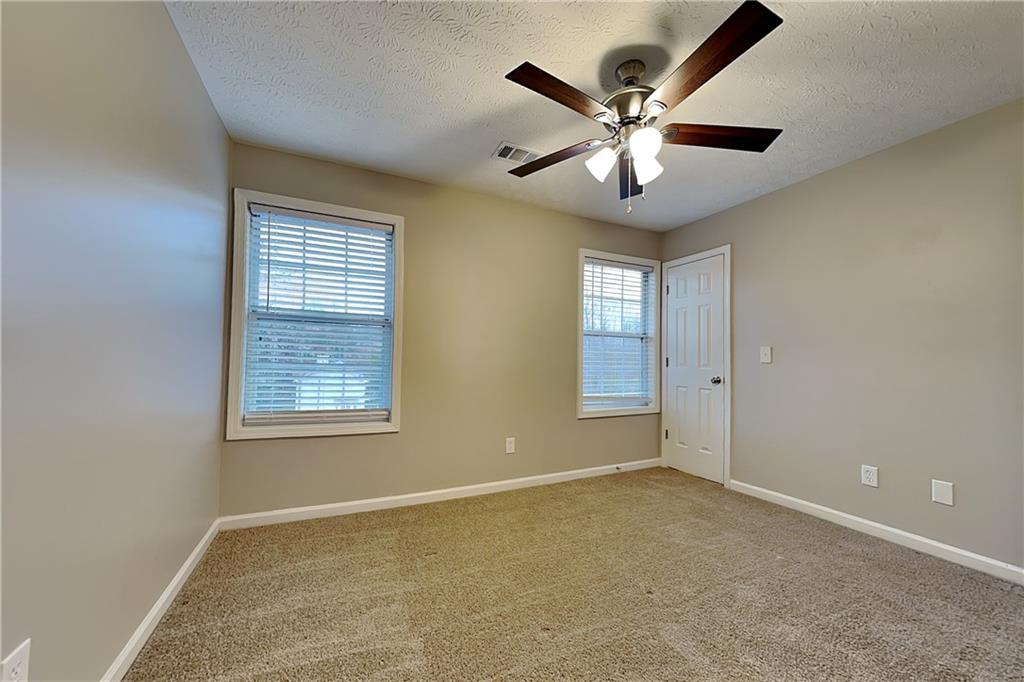 1664 Summit Pl Way Loganville, GA 30052 - Photo 15 of 23 a view of an empty room with a window