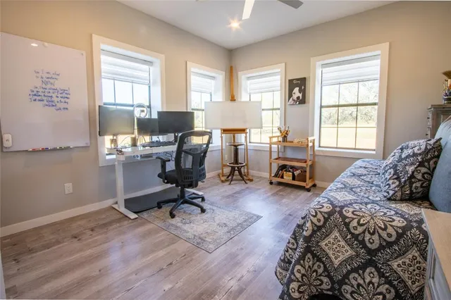 a bedroom with a workspace