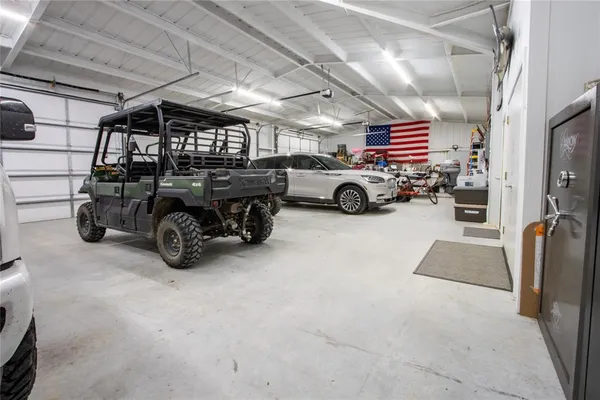 a view of a garage with parked cars