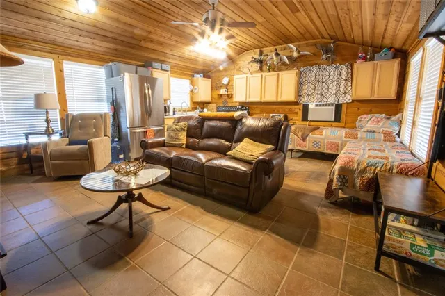 a kitchen with stainless steel appliances a refrigerator and cabinets