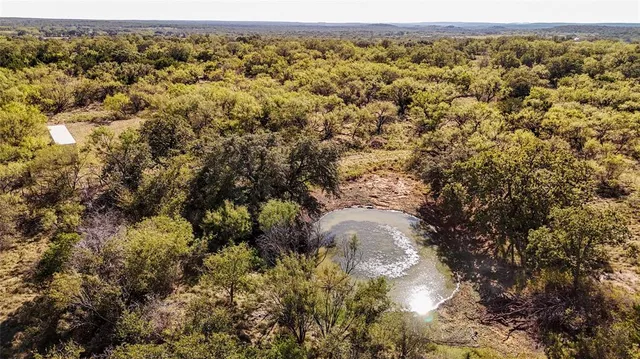 an aerial view of residential houses and wooden fence
