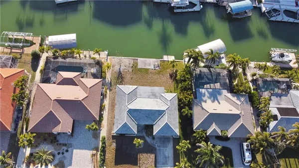 an aerial view of a house with a lake view