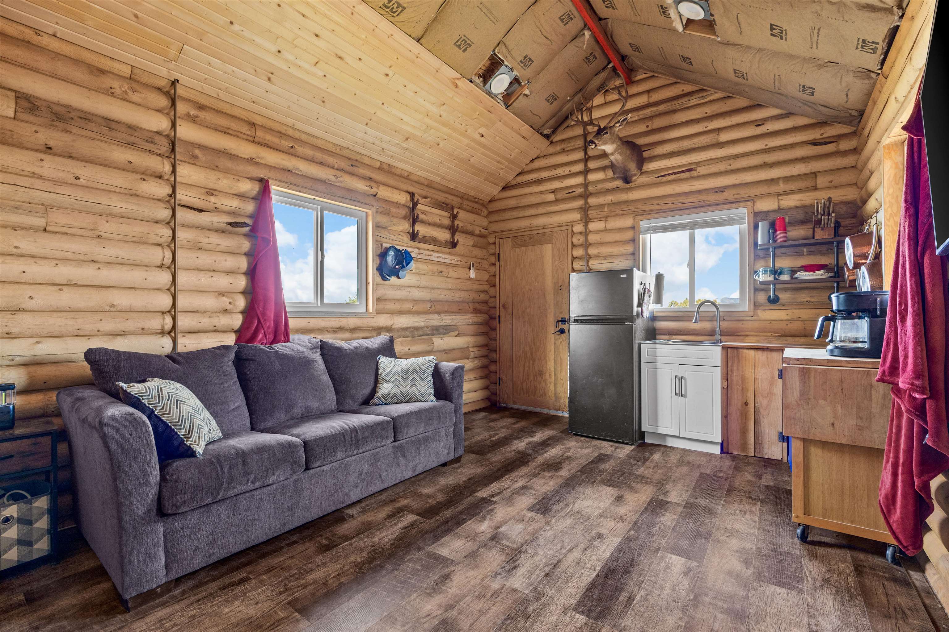 4193 V 5/10 Road De Beque, CO 81630 - Photo 19 of 39 a living room with furniture and a kitchen