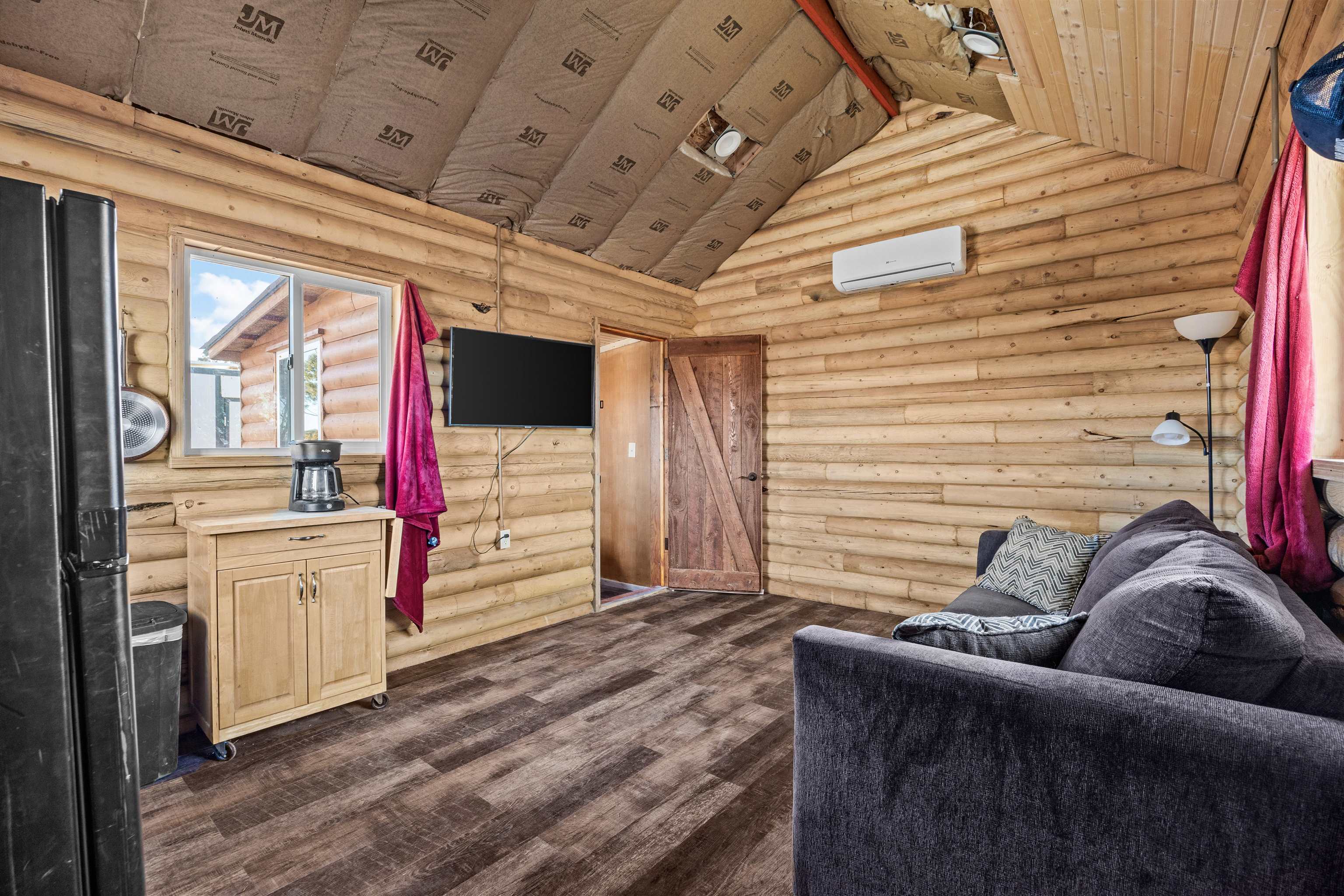 4193 V 5/10 Road De Beque, CO 81630 - Photo 23 of 39 a living room with furniture and a flat screen tv