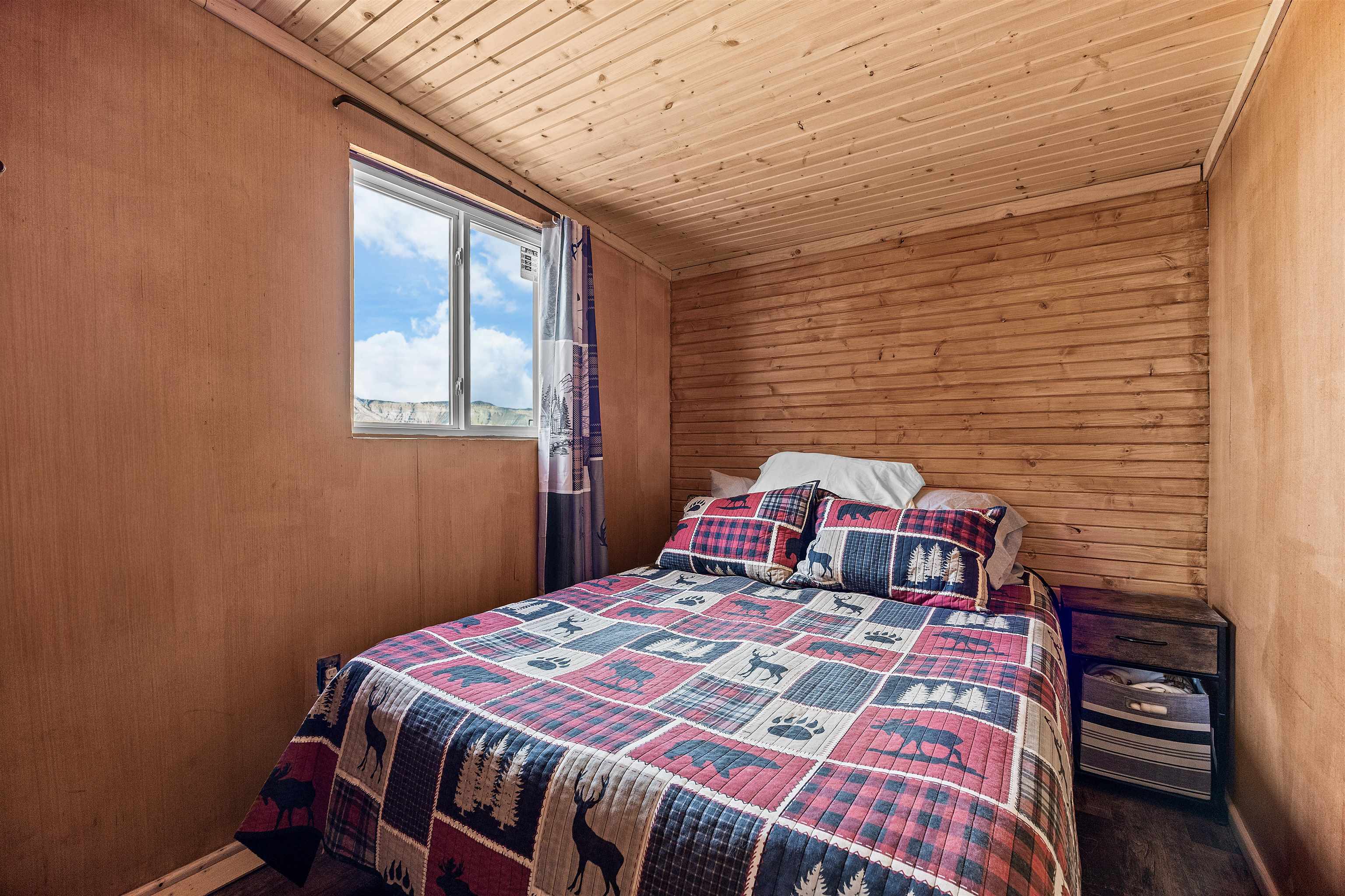 4193 V 5/10 Road De Beque, CO 81630 - Photo 24 of 39 a bedroom with a bed and a closet