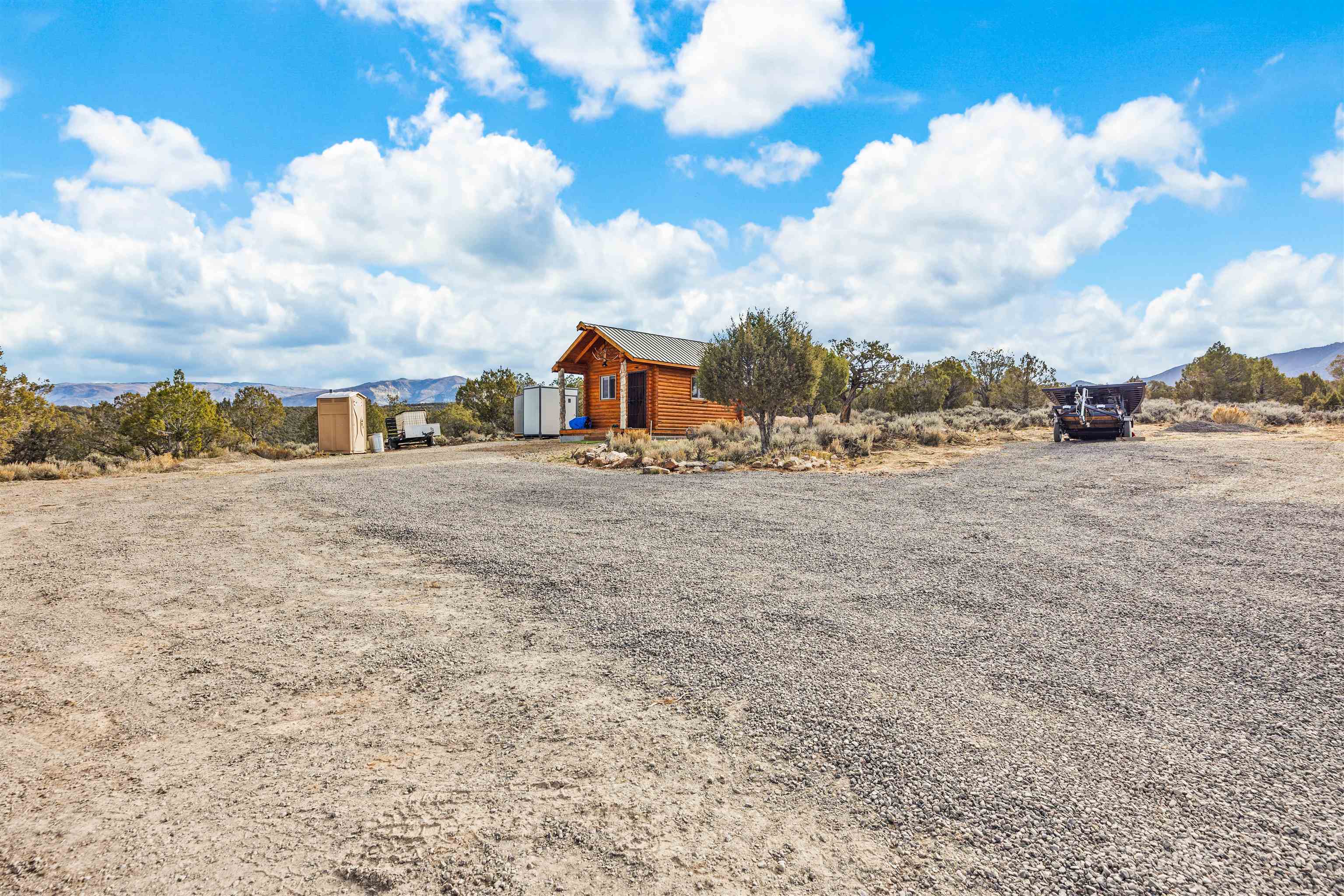 4193 V 5/10 Road De Beque, CO 81630 - Photo 25 of 39 a view of a dry yard with wooden fence