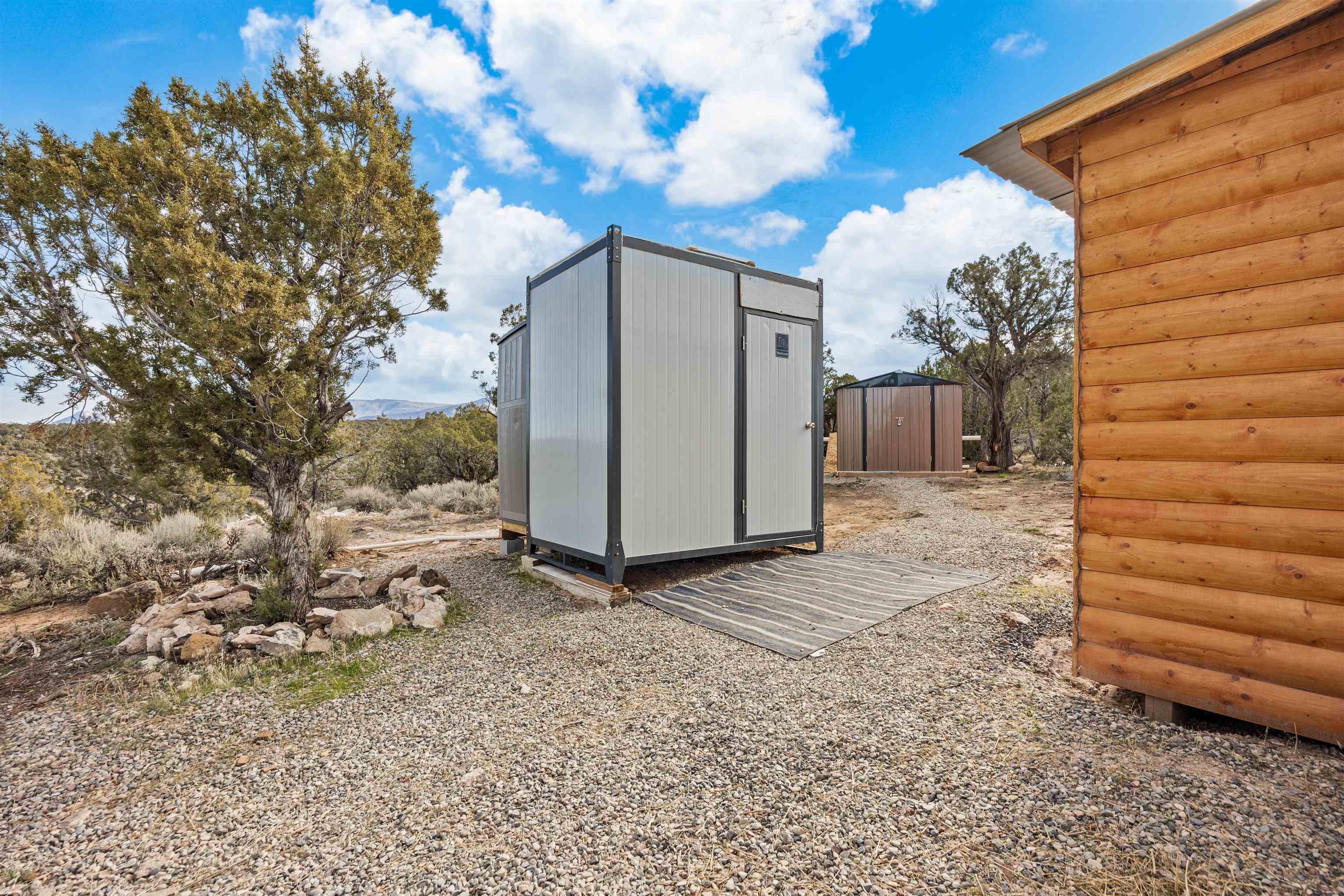 4193 V 5/10 Road De Beque, CO 81630 - Photo 26 of 39 a backyard of a house with lots of green space