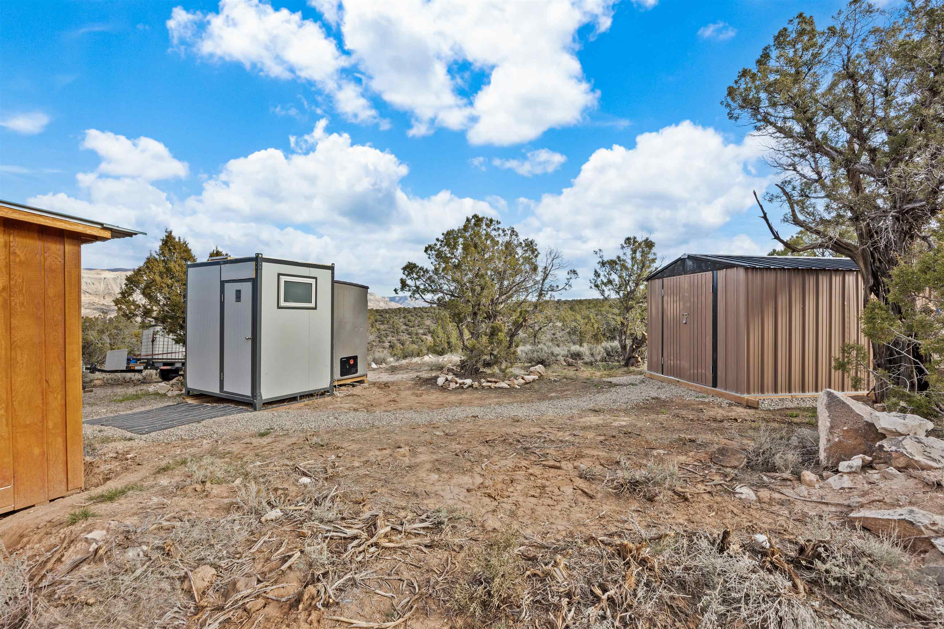 4193 V 5/10 Road De Beque, CO 81630 - Photo 27 of 39 a view of a house with backyard and trees