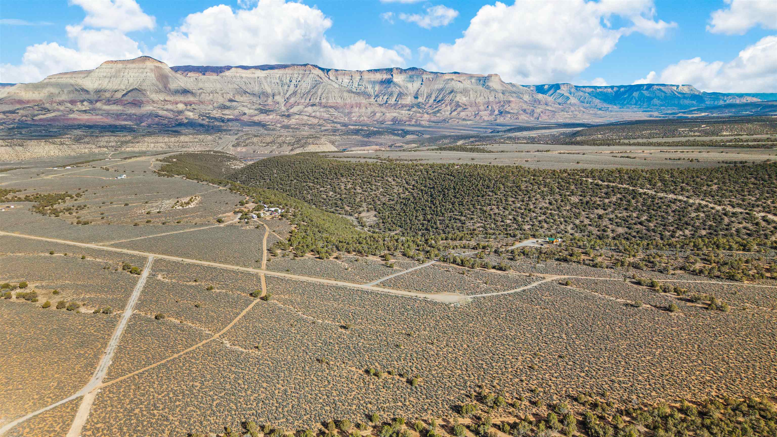 4193 V 5/10 Road De Beque, CO 81630 - Photo 31 of 39 a view of water heater and covered with wooden floor
