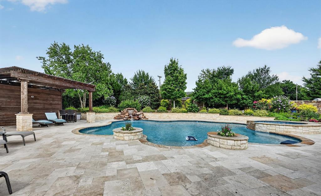 6656 Roughleaf Ridge Road Flower Mound, TX 76226 - Photo 34 of 40 a view of backyard with swimming pool and outdoor seating