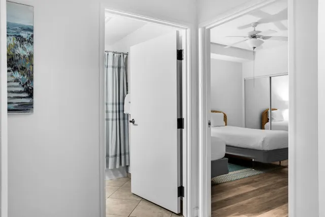 a bedroom with a bed and flat screen tv