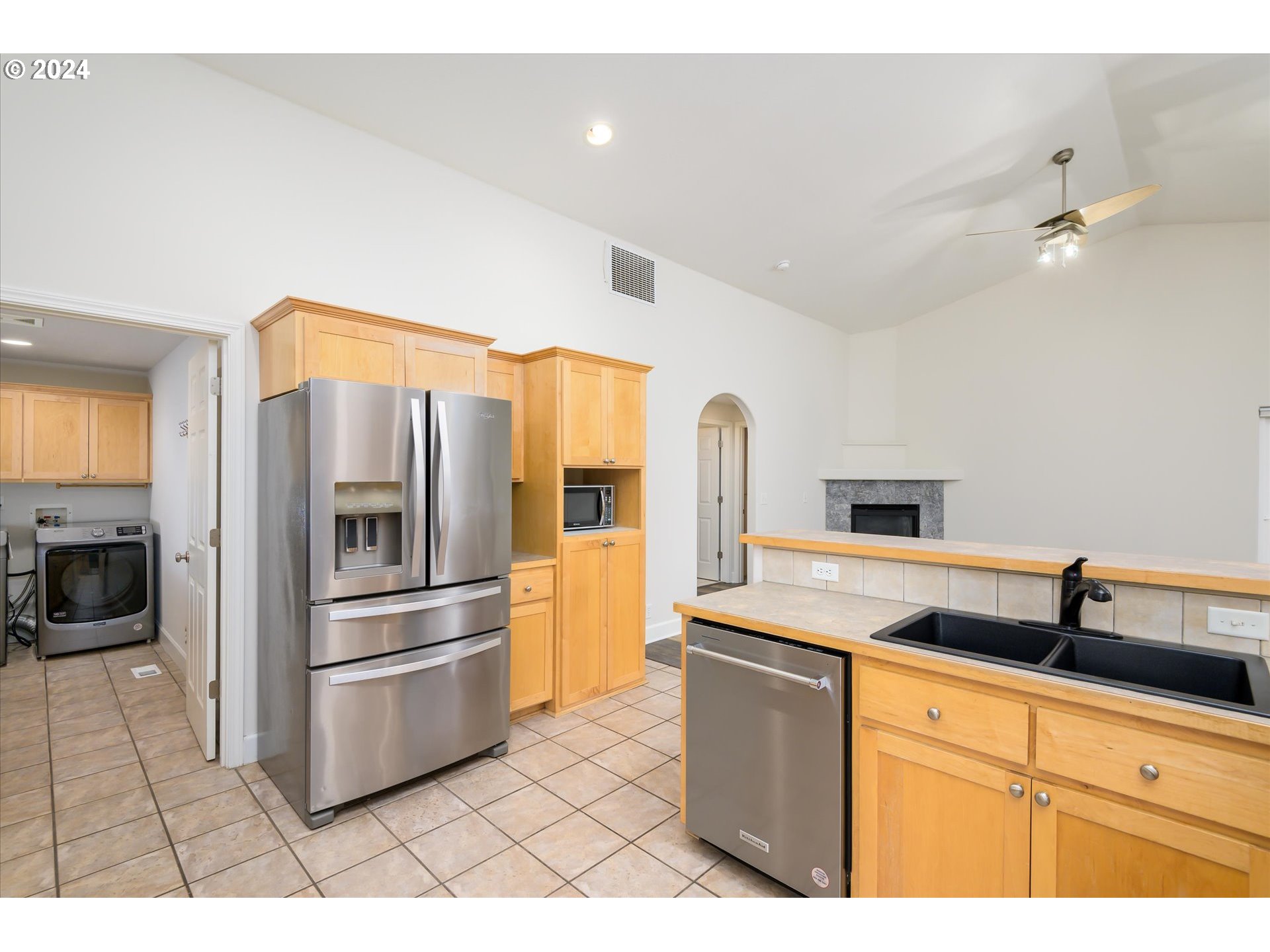 654 62nd Street Springfield, OR 97478 - Photo 16 of 41 a kitchen with granite countertop a refrigerator and a sink