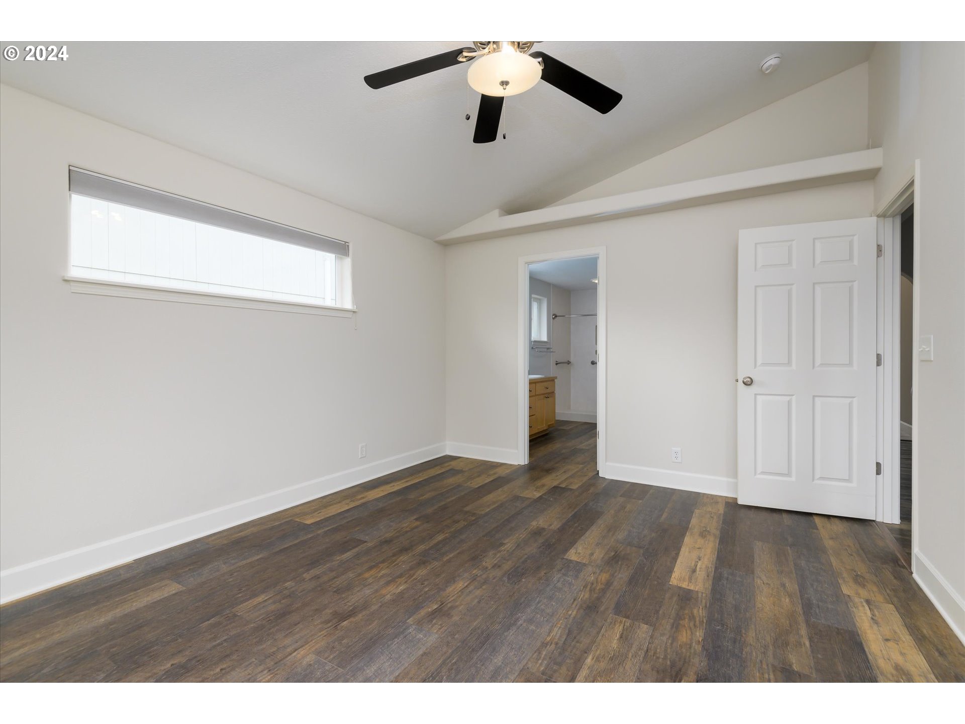 654 62nd Street Springfield, OR 97478 - Photo 19 of 41 a view of an empty room with wooden floor